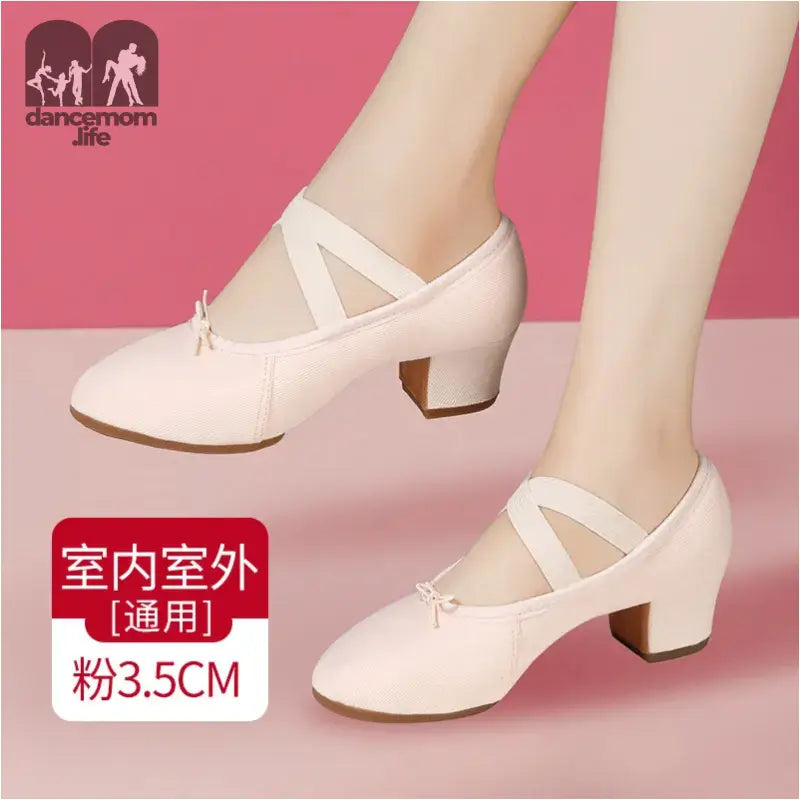 Pink dance shoes with block heels.