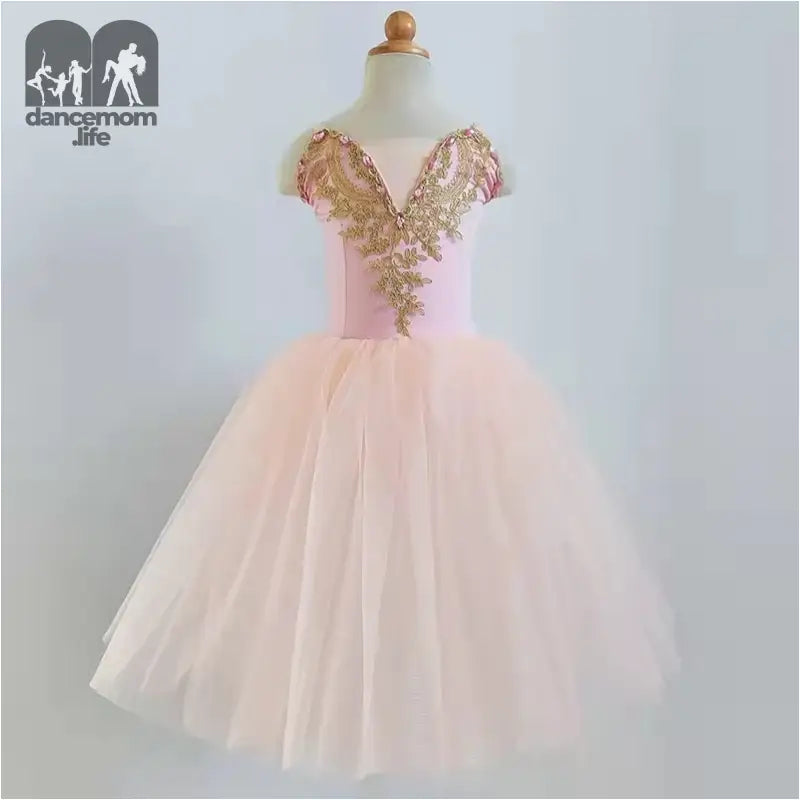 Pink tulle dress with gold sequined bodice and cap sleeves.