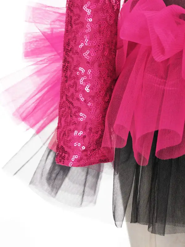 Pink sequined fabric with tulle layers in pink, white and black.