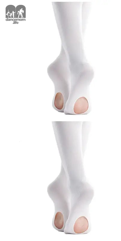 White ballet pointe shoes with holes cut in the soles.