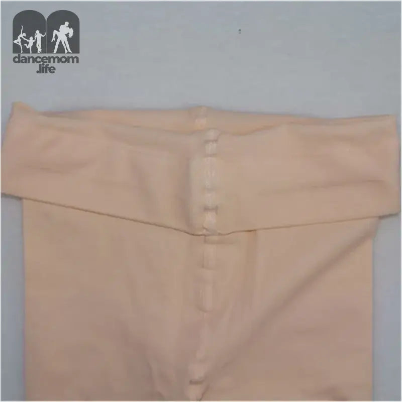 Beige button-up garment with a folded collar.