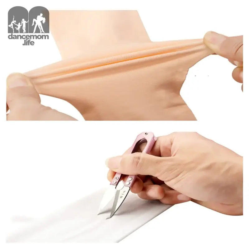 Hands stretching and cutting a piece of elastic or rubber material.