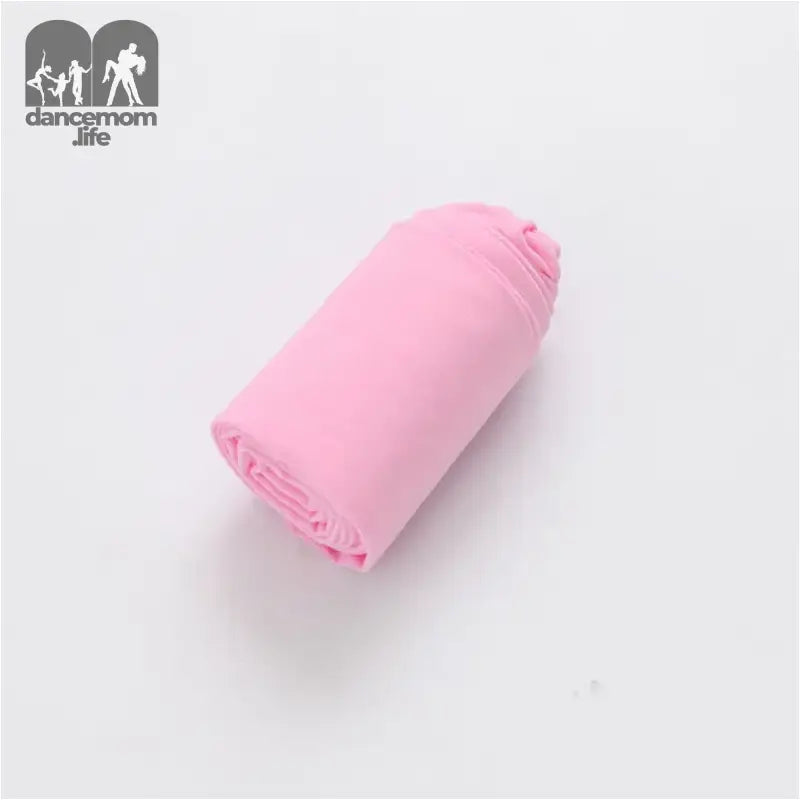 Pink rolled-up fabric or textile material.