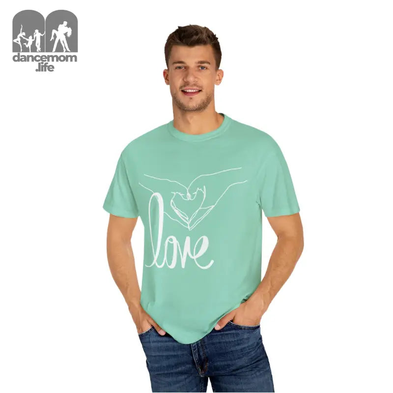 Mint green t-shirt with white ’love’ text and hand design.