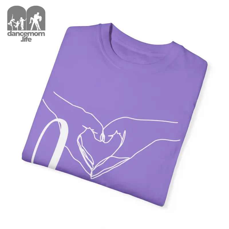 Purple t-shirt with white line art of hands forming a heart shape.