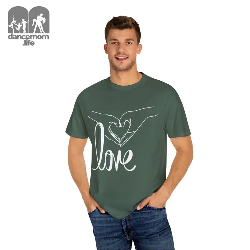 Green t-shirt with white ’love’ text and hand design on the front.