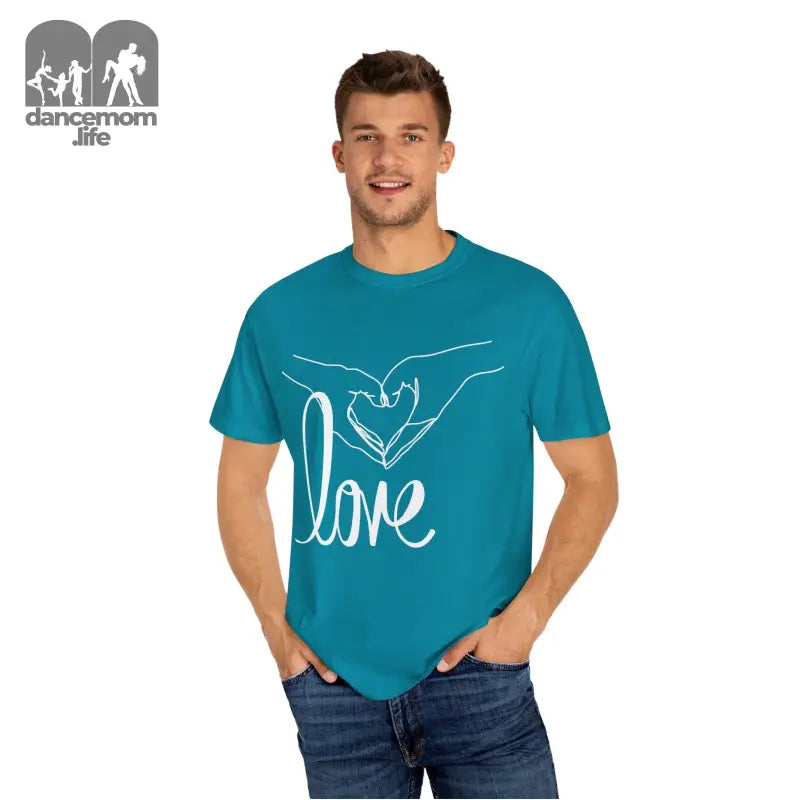 Teal t-shirt with white ’love’ text and hand-drawn heart design.