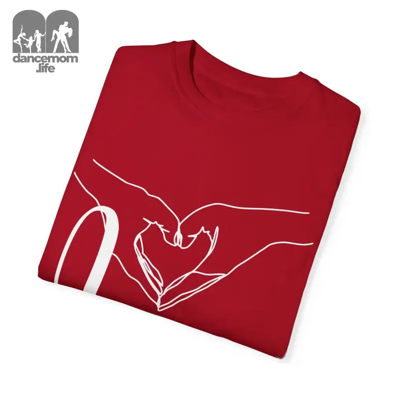 Red t-shirt with white line art showing hands forming a heart shape.