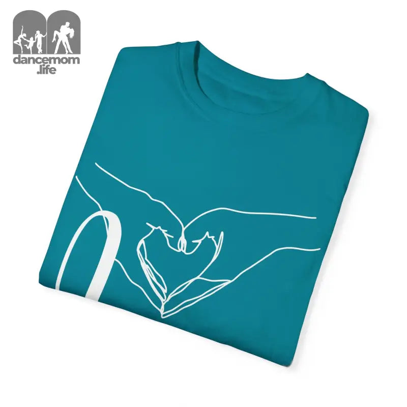 Teal t-shirt with white line art showing hands forming a heart shape.