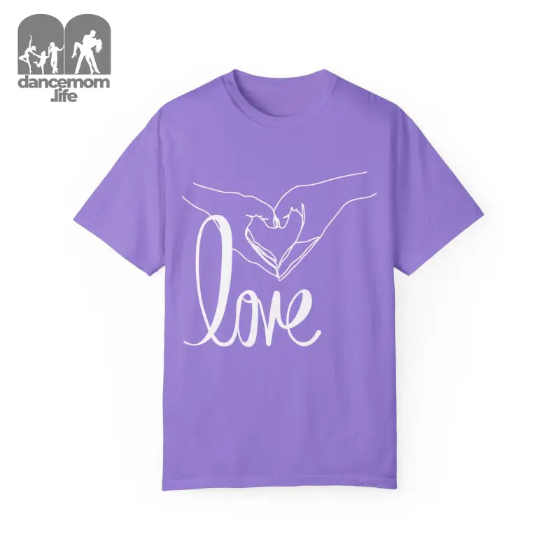 Purple t-shirt with white hands forming a heart shape and ’love’ text design.