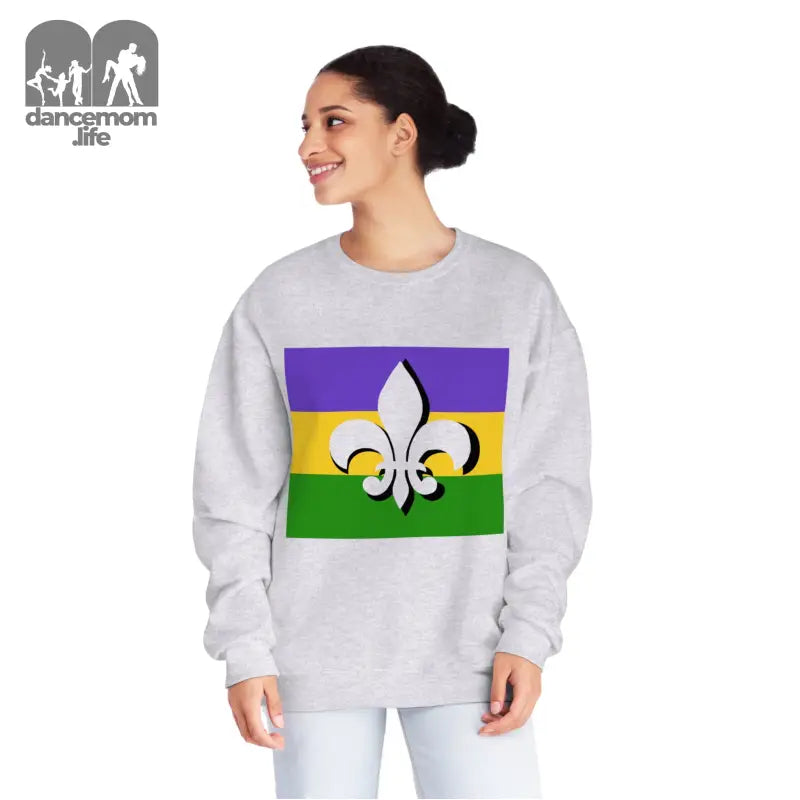 White sweatshirt featuring a Mardi Gras flag design with purple, gold, and green stripes and a fleur-de-lis symbol.