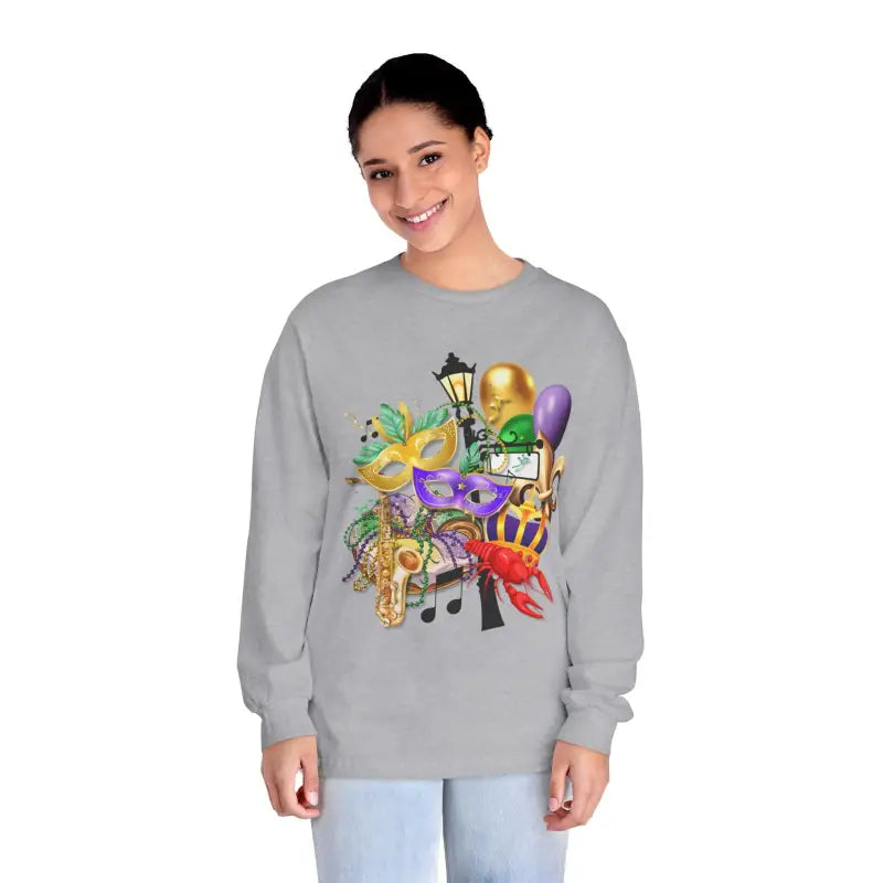Grey sweatshirt featuring colorful Mardi Gras themed artwork with masks, musical notes, and party decorations.