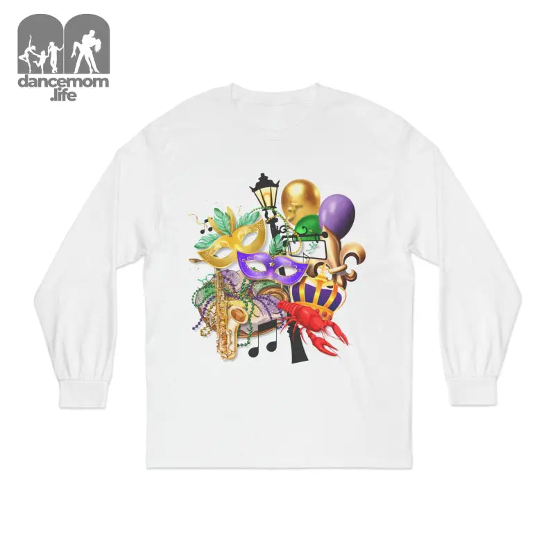 White long-sleeve t-shirt with colorful Mardi Gras themed artwork featuring masks, balloons, musical notes, and festive decorations.