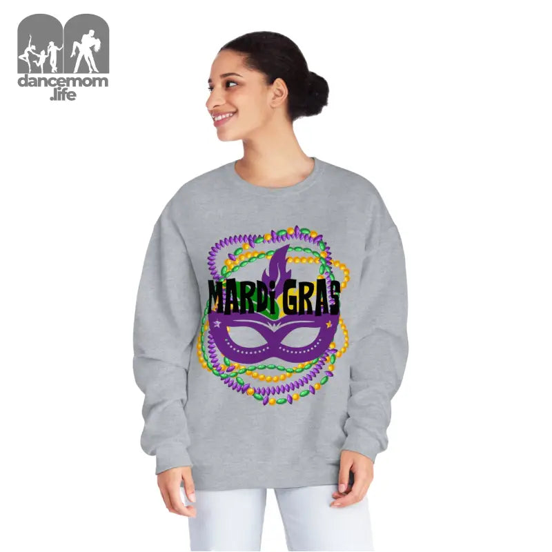 Grey sweatshirt featuring a colorful Mardi Gras mask design with beaded decorations.