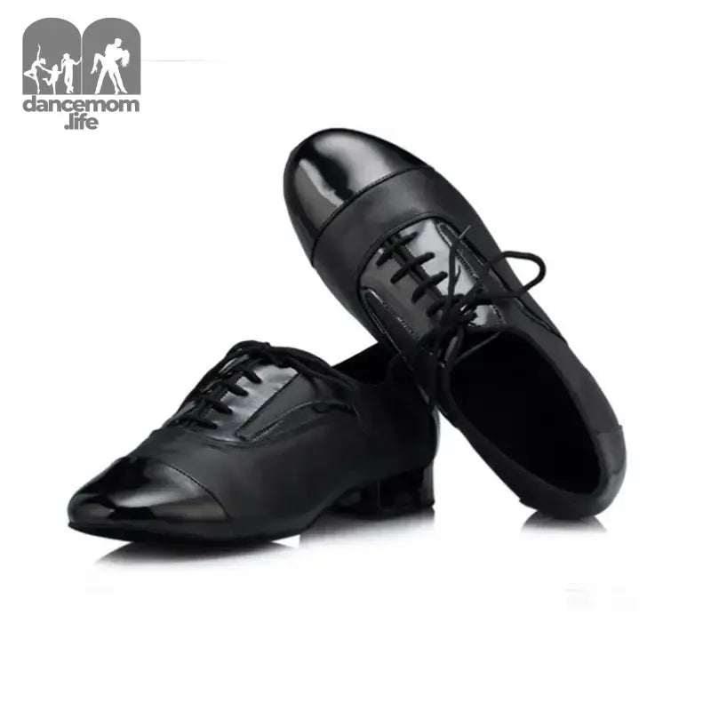Pair of black leather dance shoes.