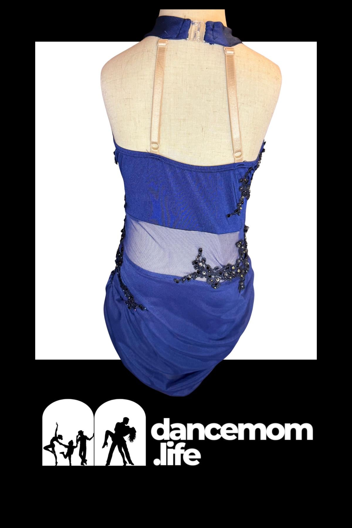 Blue dance leotard with a halter neckline, mesh panel at the waistline adorned with black beading, and beige shoulder straps.