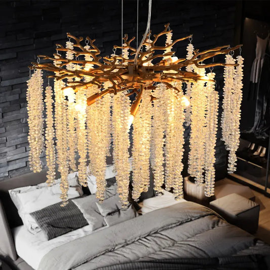 Branch-like chandelier with crystal strands.