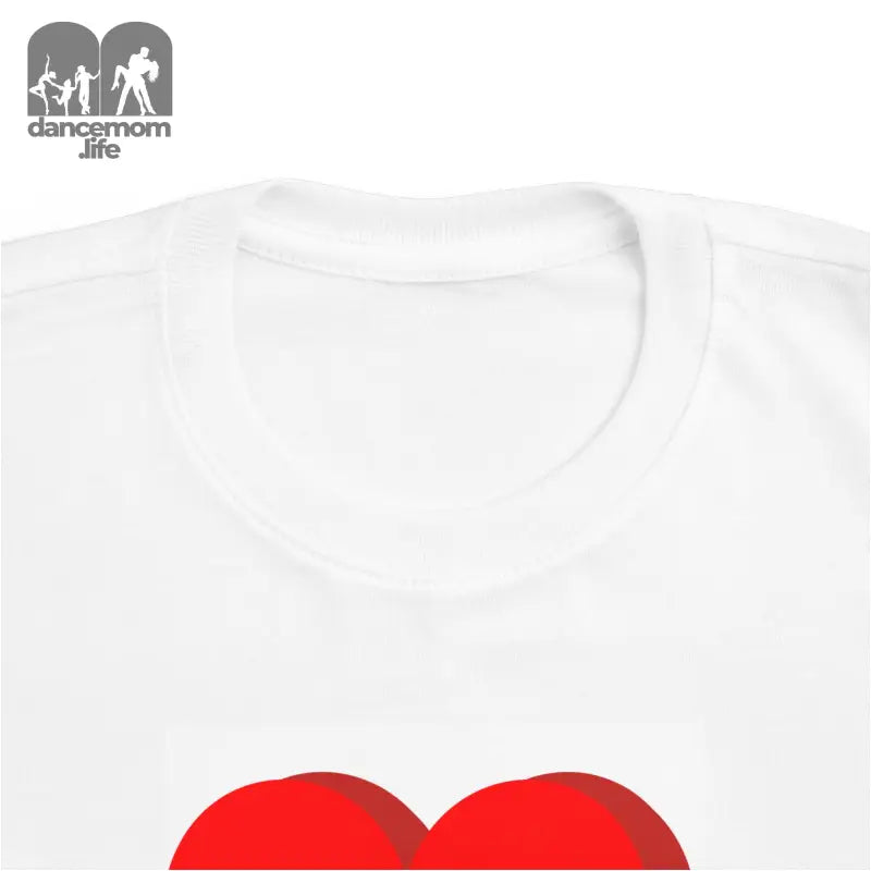 White t-shirt with a red heart design.