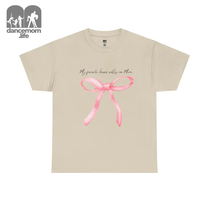 Beige t-shirt with a pink bow design and text printed on the front.