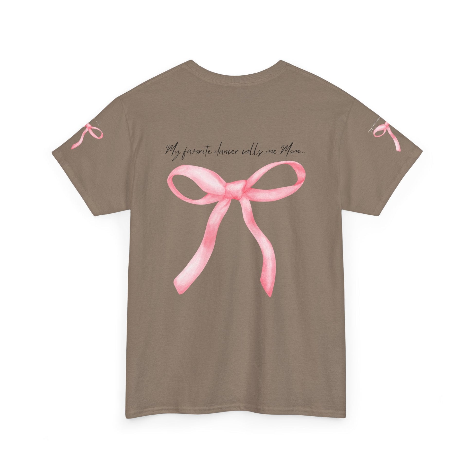 A taupe short-sleeved t-shirt featuring a watercolor-style pink ribbon bow centered on the back, with matching small bows printed near each sleeve cuff and the phrase ’my favorite dancer calls me mom...’ written in cursive script above it.