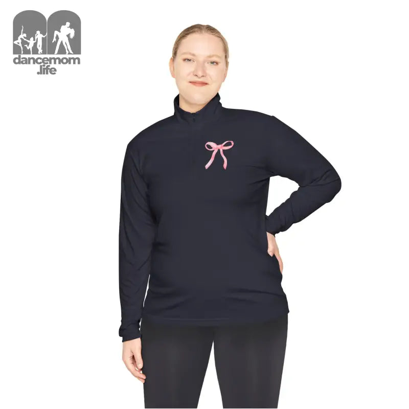 Navy blue turtleneck sweater with a pink bow embroidered on the chest.