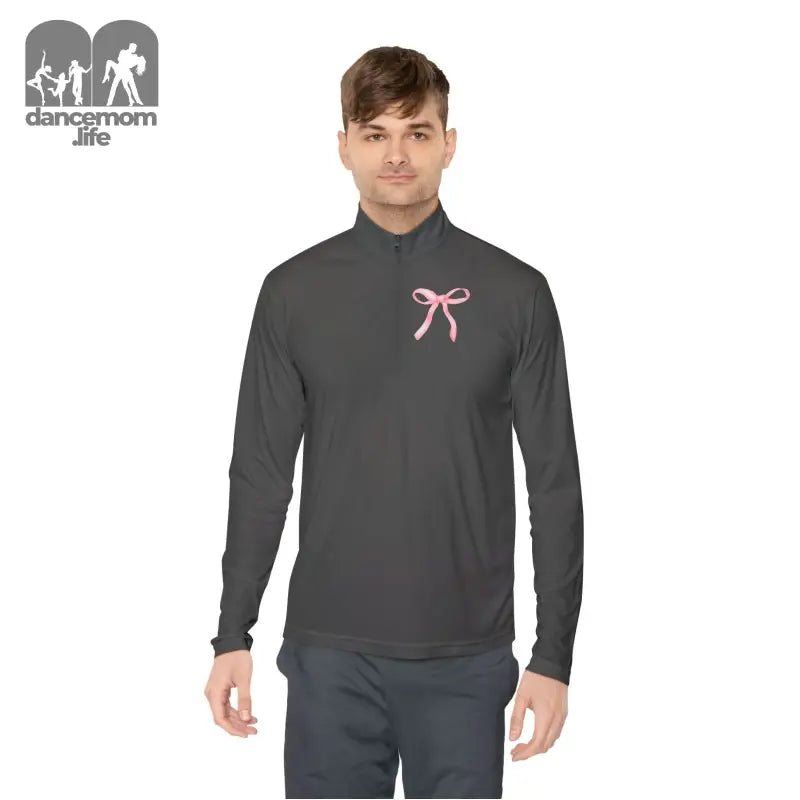 Dark gray athletic quarter-zip pullover with a pink ribbon accent on the chest.