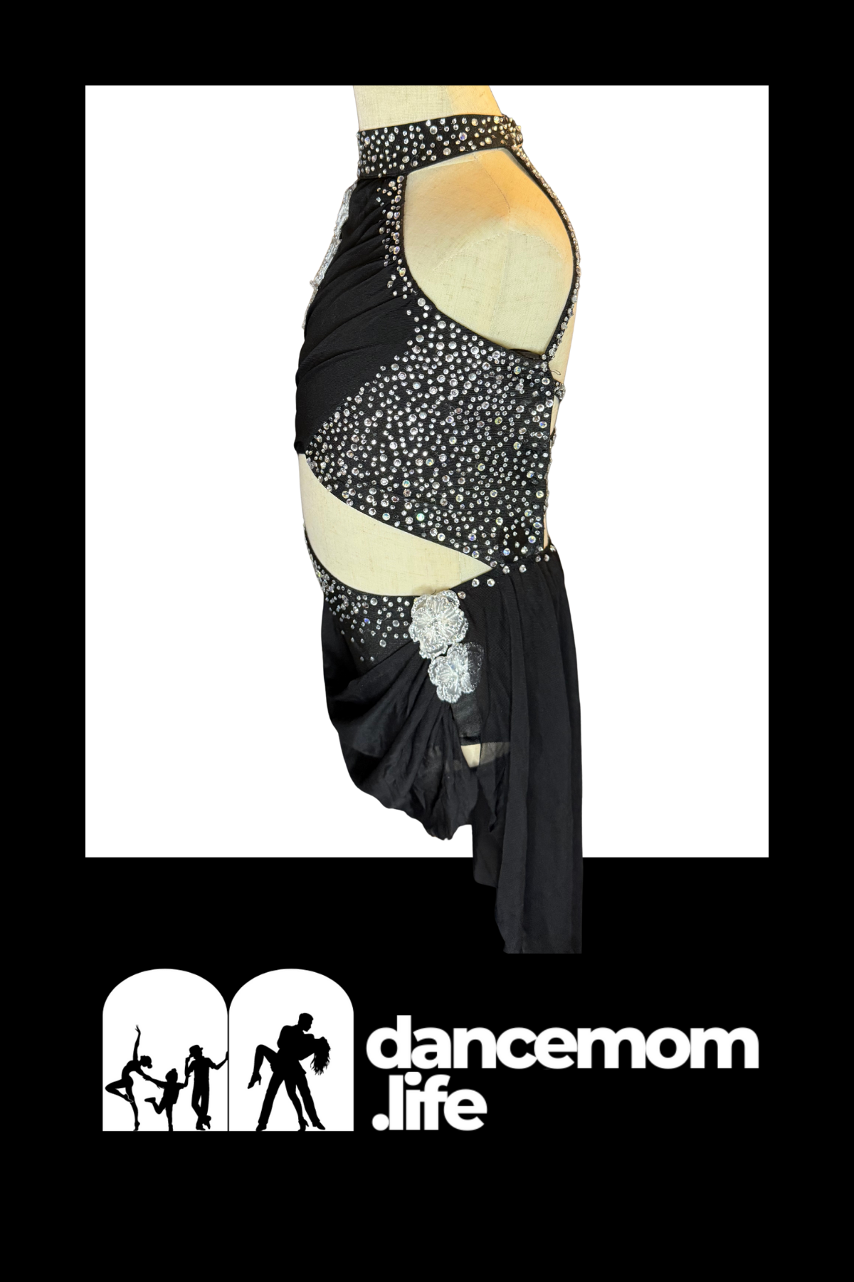 Black dance leotard with sparkling silver rhinestone embellishments and a decorative floral appliqué at the hip.
