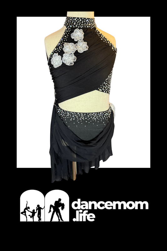 Black dance leotard with silver floral embellishments and sparkling rhinestones along the neckline, shoulder straps, and waistband.