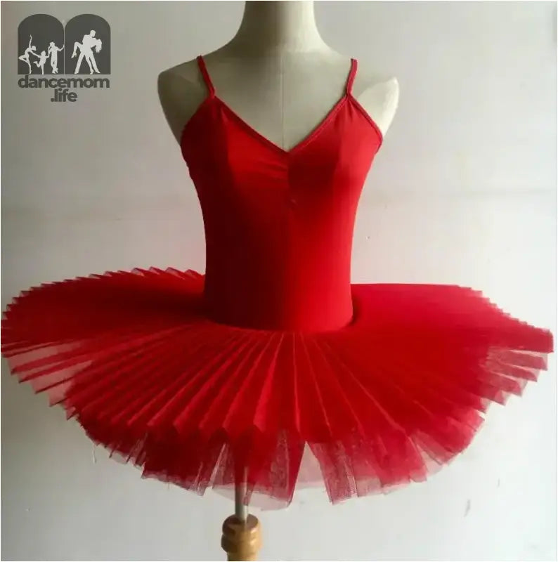 Bright red ballet tutu with spaghetti straps and a pleated tulle skirt.