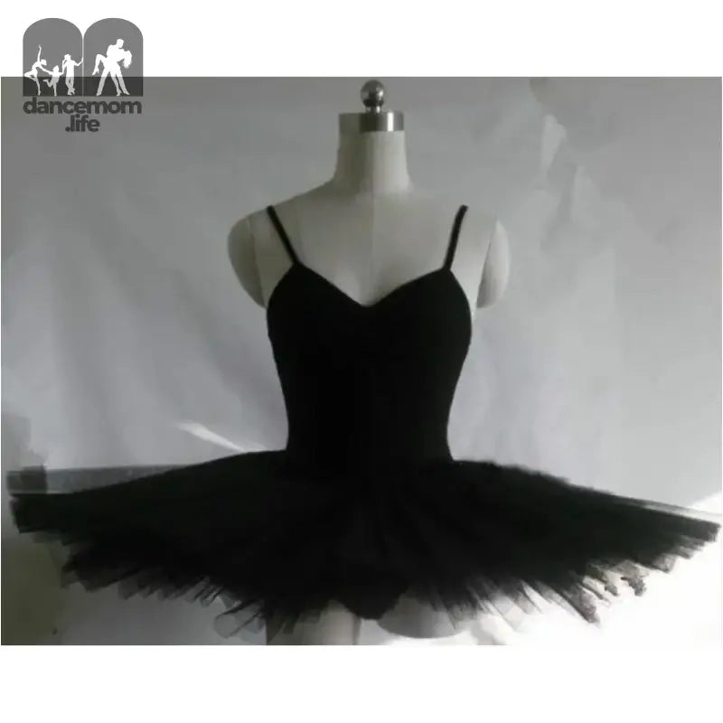 Black ballet tutu with spaghetti straps and a full layered tulle skirt.