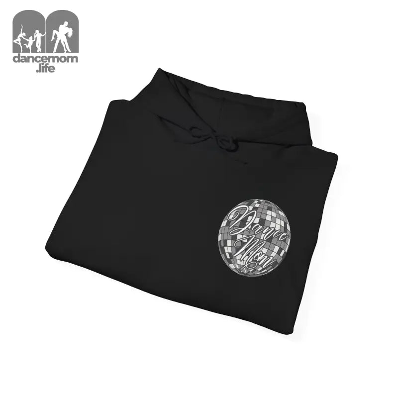 Black folded sweatshirt with a circular graphic design on the front.