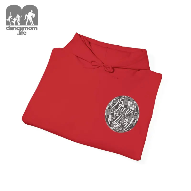 Red sweatshirt with a circular metallic design on the front.