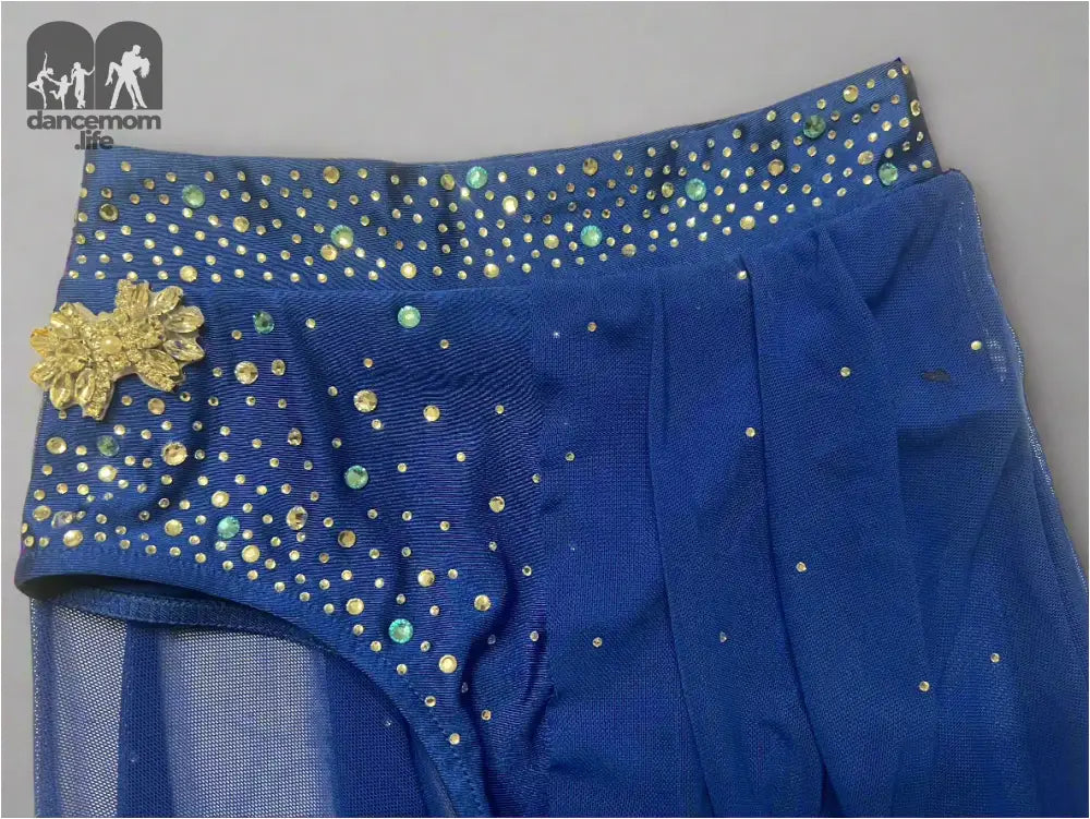 Blue dance skirt with sparkly gold accents and a mesh overlay.