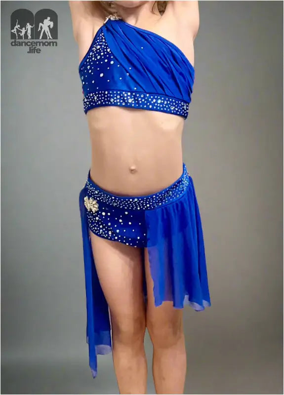 Blue two-piece dance costume with rhinestone embellishments and an asymmetrical skirt.