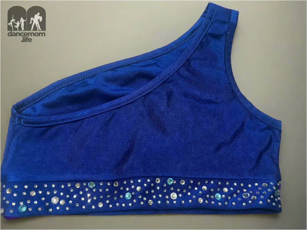 Blue one-shoulder sports bra with a sparkly band at the bottom.