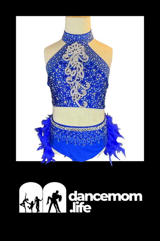 Blue sequined dance leotard with silver beading and feather trim.