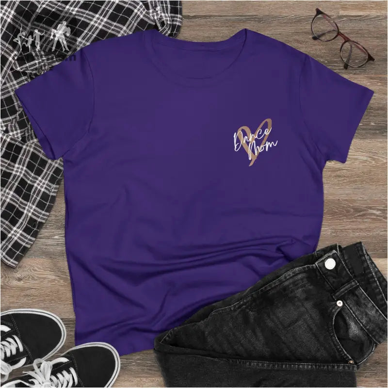 Purple t-shirt with a small metallic design on the chest.