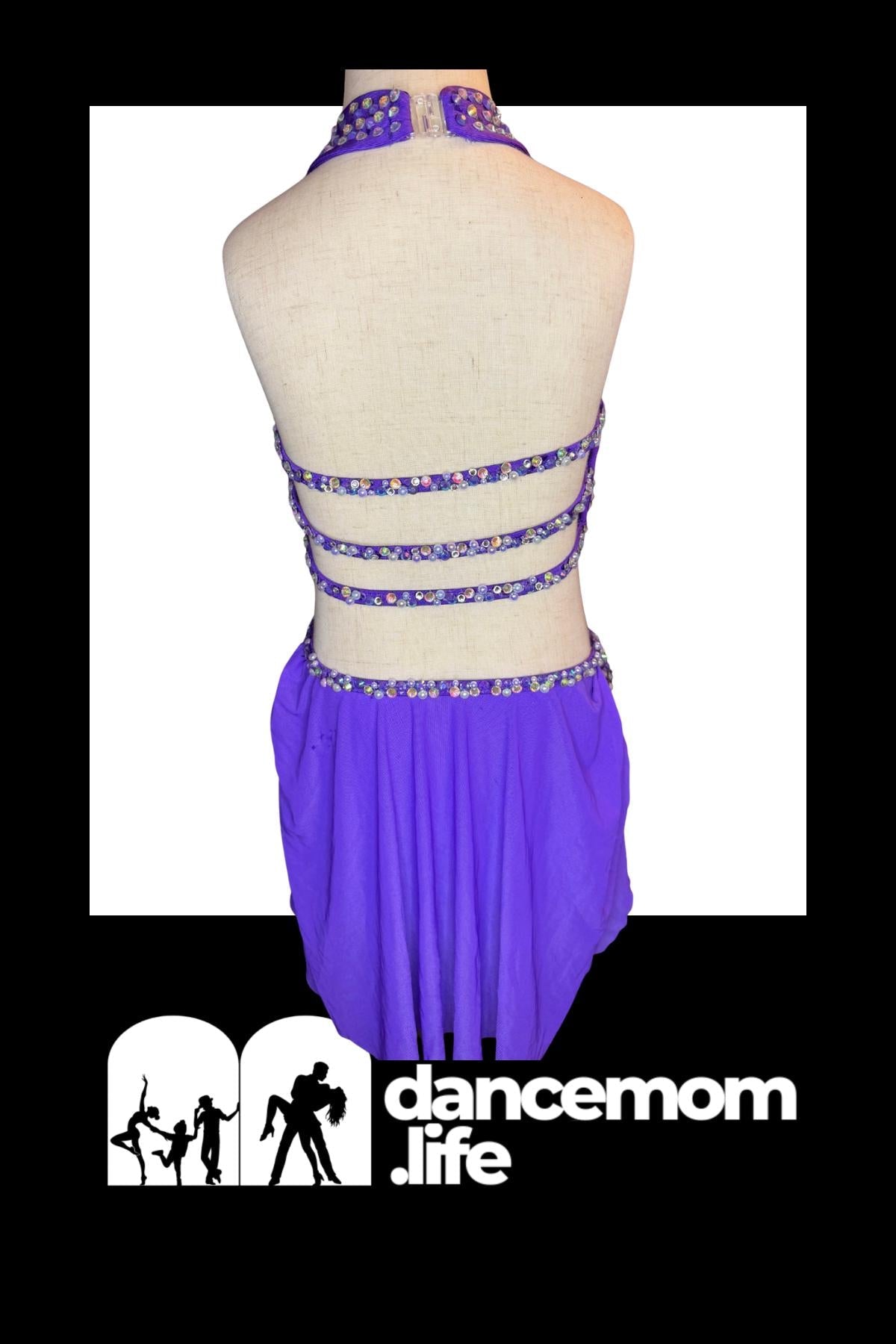 Purple halter dance leotard with beaded straps and a matching skirt.