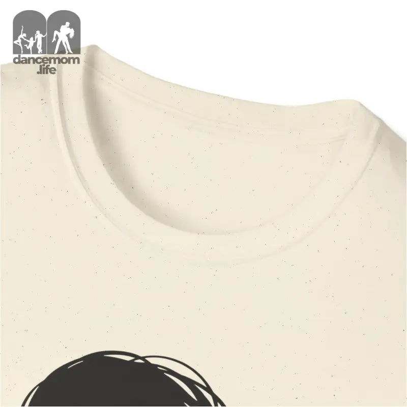 Cream-colored t-shirt with a partial black graphic design visible at the bottom.