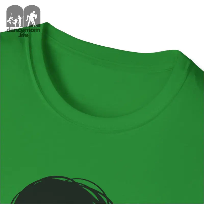 Green crew neck t-shirt with partial black graphic visible.