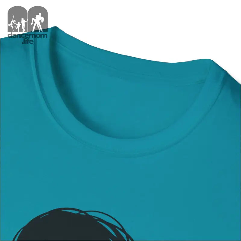 Teal or turquoise colored t-shirt with part of a black graphic visible.