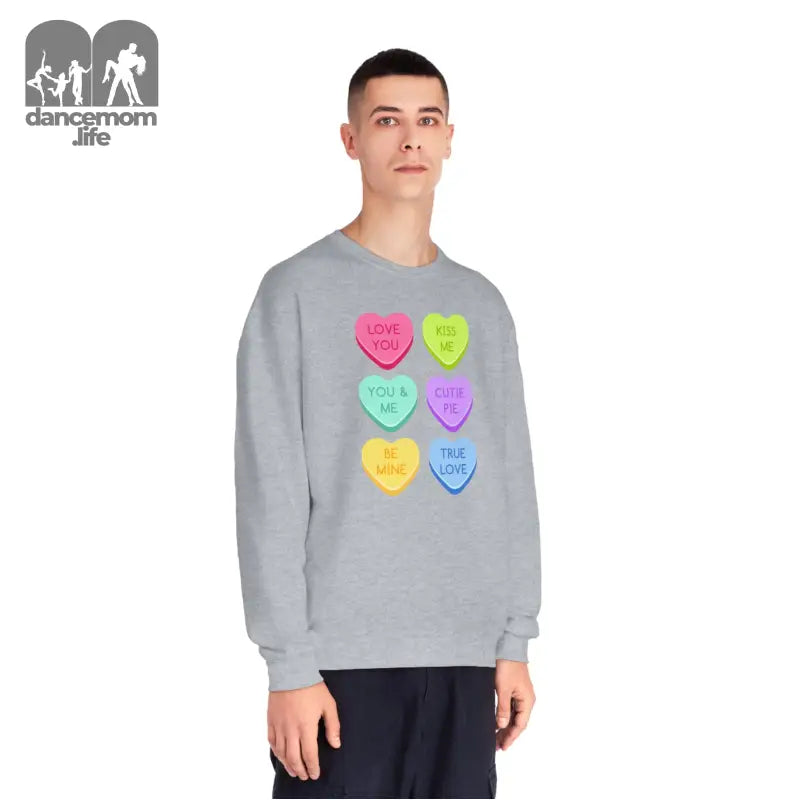 Grey sweatshirt featuring six colorful candy heart designs arranged in rows.