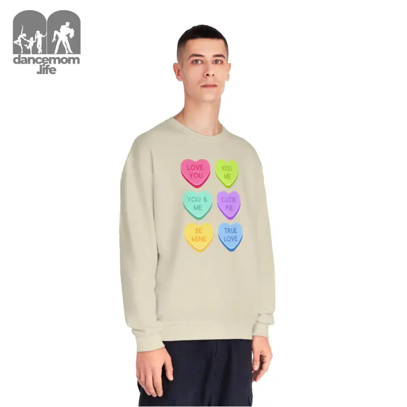 Beige sweatshirt featuring six colorful candy heart designs arranged in rows.