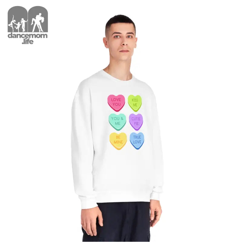 White sweatshirt featuring colorful candy heart designs arranged in a grid pattern.