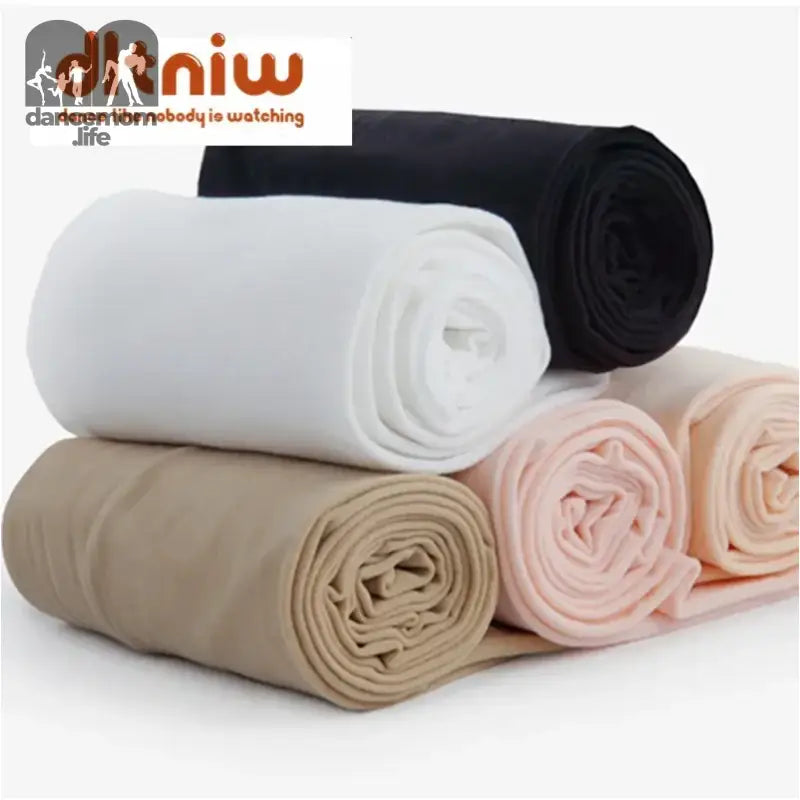 Rolled fabric pieces in white, black, beige, and pink colors.