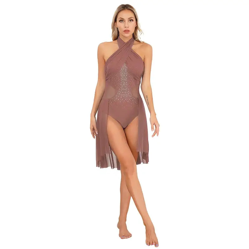 Mauve halter-neck swimsuit with sheer overlay skirt and rhinestone embellishments.