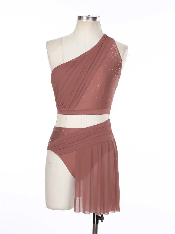 Dusty rose two-piece dance costume with rhinestone accents and asymmetrical one-shoulder design.