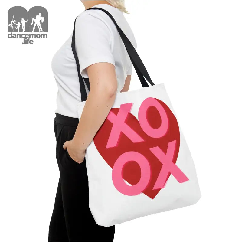 White tote bag featuring ’XOXO’ text in red and pink colors.